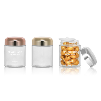 Okrągły 100g szklany pojemnik na kapsułki z różową złotą nakrętką Sliver Cap Glass Jar Packaing