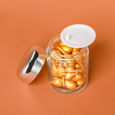 Okrągły 100g szklany pojemnik na kapsułki z różową złotą nakrętką Sliver Cap Glass Jar Packaing