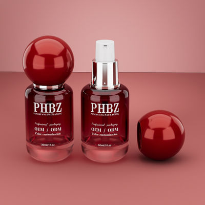 30 ml / 1 oz Pustka butelka z czerwonym szklanym serum kosmetycznym z okrągłą czapką kulkową, kolorystyczny OEM ODM opakowanie do pielęgnacji skóry do oleju eterycznego
